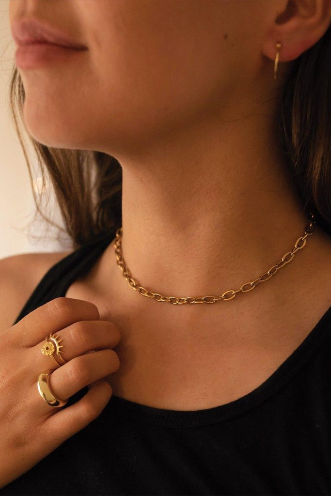 gold never goes out of style , girl wearing a gold jewelry