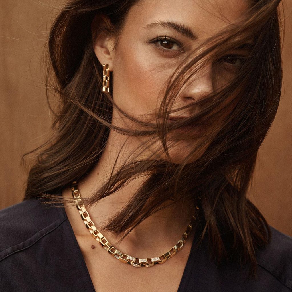 gold never goes out of style , a girl waering gold chain